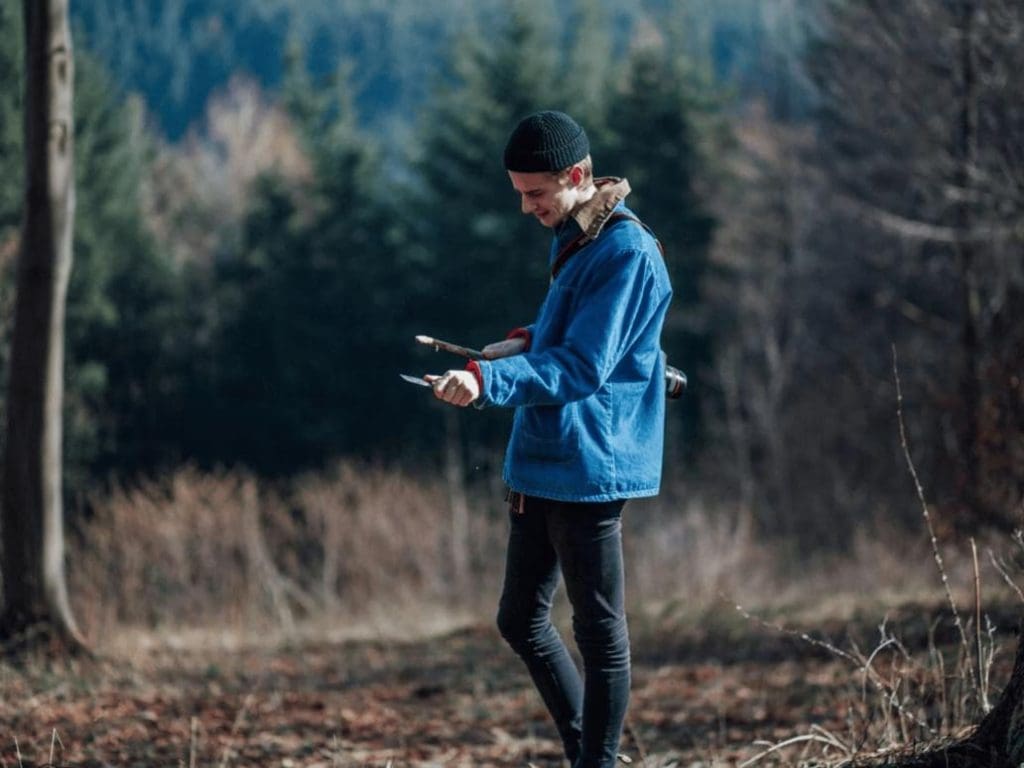 teacher in the woods looking at a map