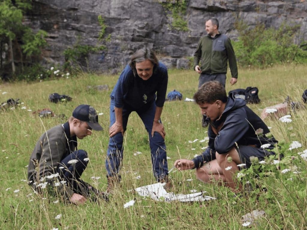 secondary school group in a field doing filed study work