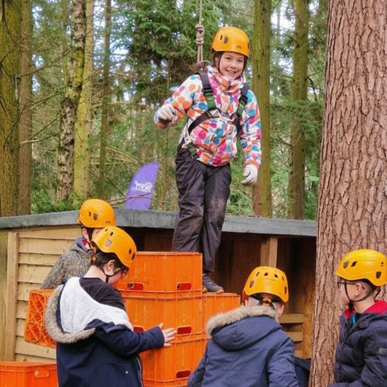 group of school pupils doing create stacking activity