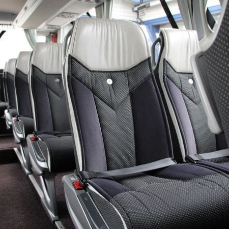 an internal coach with leather and cloth seats