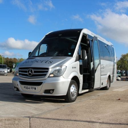 mini bus located in a car park with its doors open