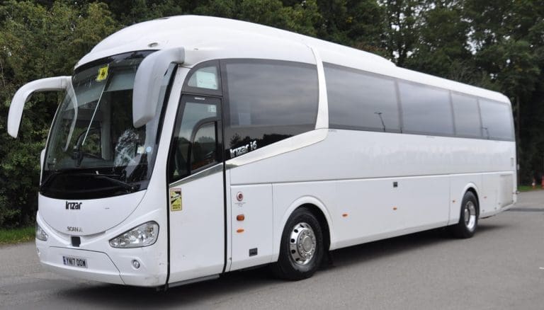 coach in a cark park for continental coaches promoting for school trip transport hire