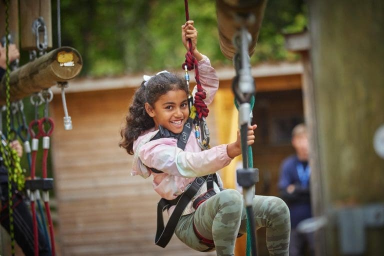 primary school pupil on zip line