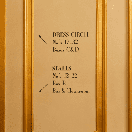 stage seating instructions on a wall at the theatre