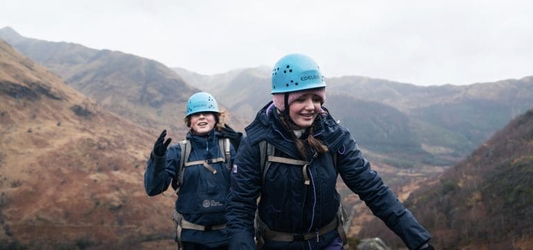 two secondary school pupils hiking in the Scottish highlands