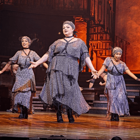 three actors dancing on stage at lyric theatre London
