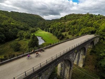 students cycling on a bridge in Derbyshire