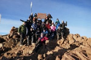 group of students on top of a mountain