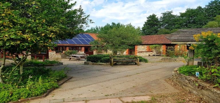 outside court yard with barn and apple trees