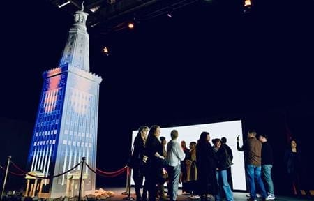 students looking at interactive history exhibit