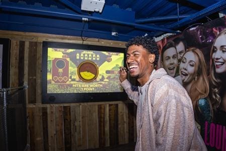 school pupil playing immersive darts