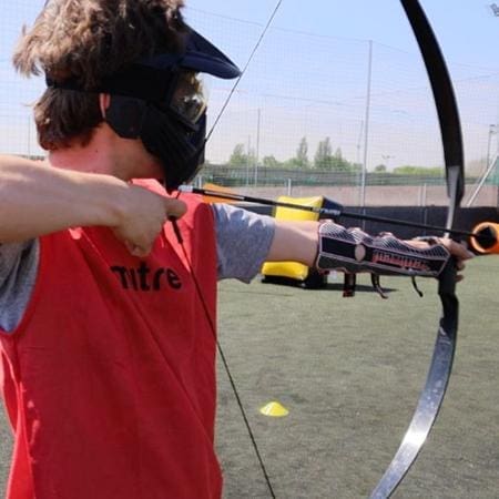 school pupil doing archery