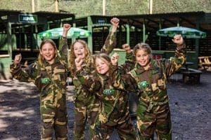 primary school group in army combats at go laser tag outside