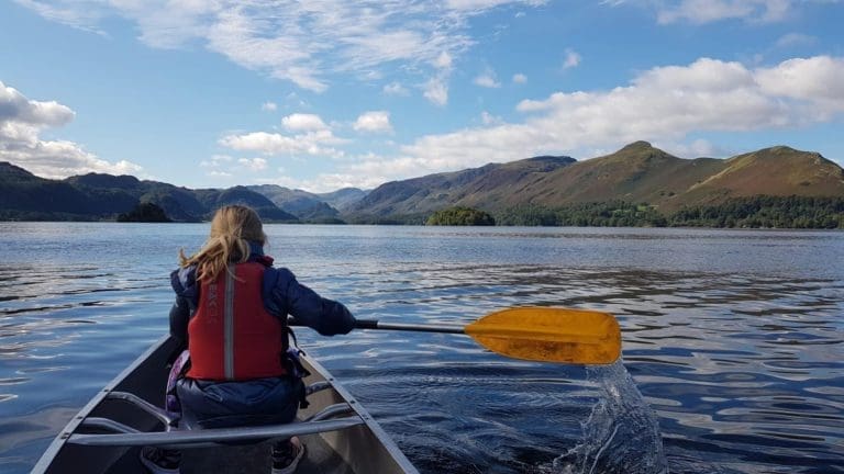 school pupil canoeing on a lake in Keswick