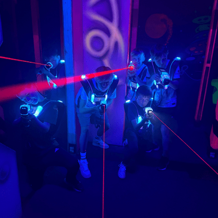 school pupils at an indoor laser tag room