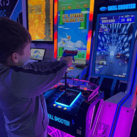 school pupil at an indoor arcade area