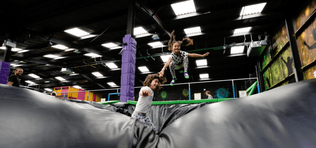 primary school children on a large inflatable bouncy ball